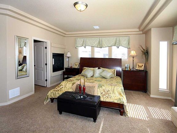 Relax in the master bedroom with fireplace and walk-out to deck!