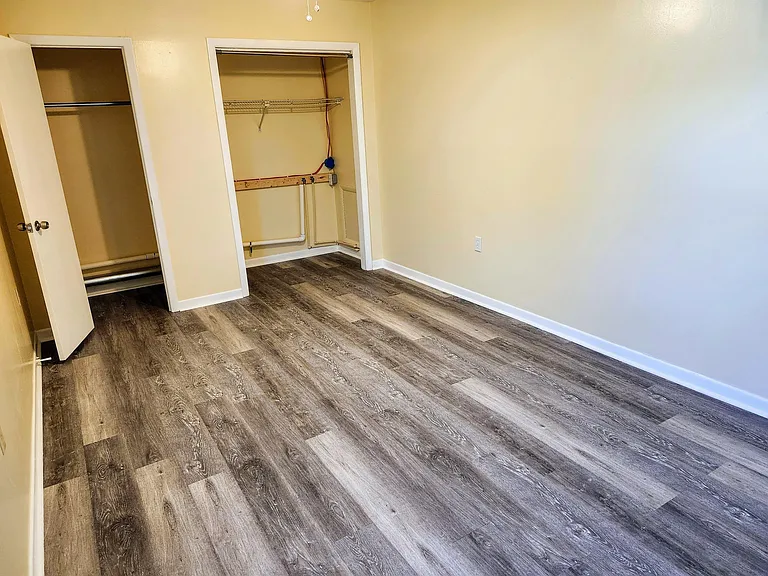 Bedroom with 2 closets including washer and dryer connections
