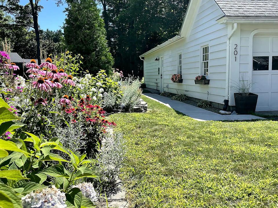 Entrance to unit with pathway only a few steps from the driveway parking spot