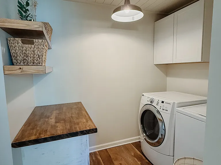 Dedicated laundry space with a full-size washer and dryer