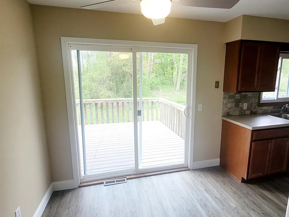 Kitchen and dining area with slider access to rear patio