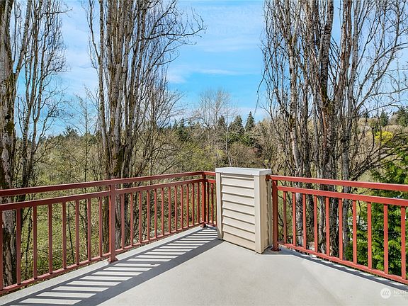 Private deck is accessed off the Primary Suite and living room! Enjoy the changing of the seasons year-long from the solitude of your own home! Notice there is not another unit in sight!>