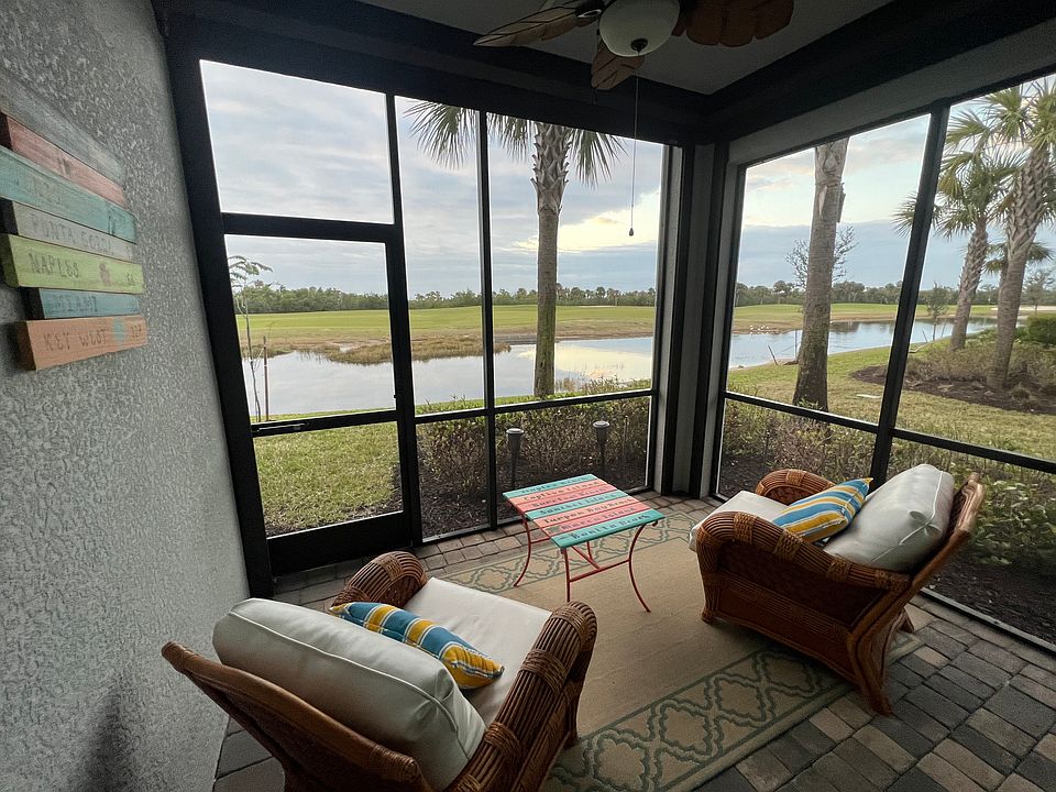 Lanai with hurricane shades for privacy or to keep the lanai warmer in the winter. Great view of the 11th fairway and watch the beautiful birds.