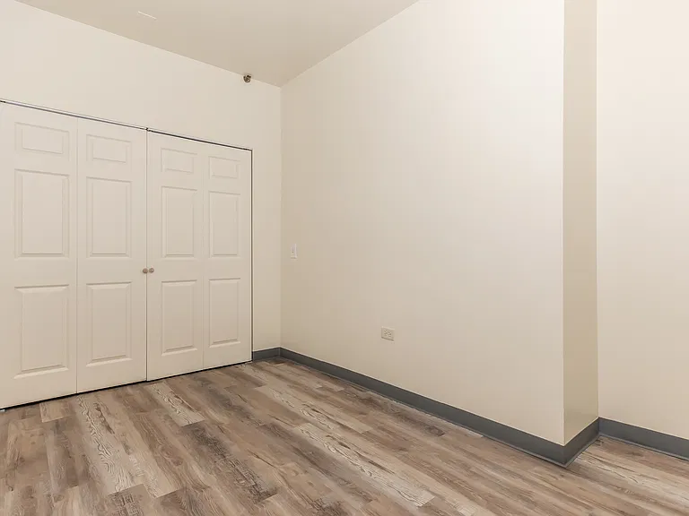 1 bedroom 1 bathroom ADA unit bedroom.