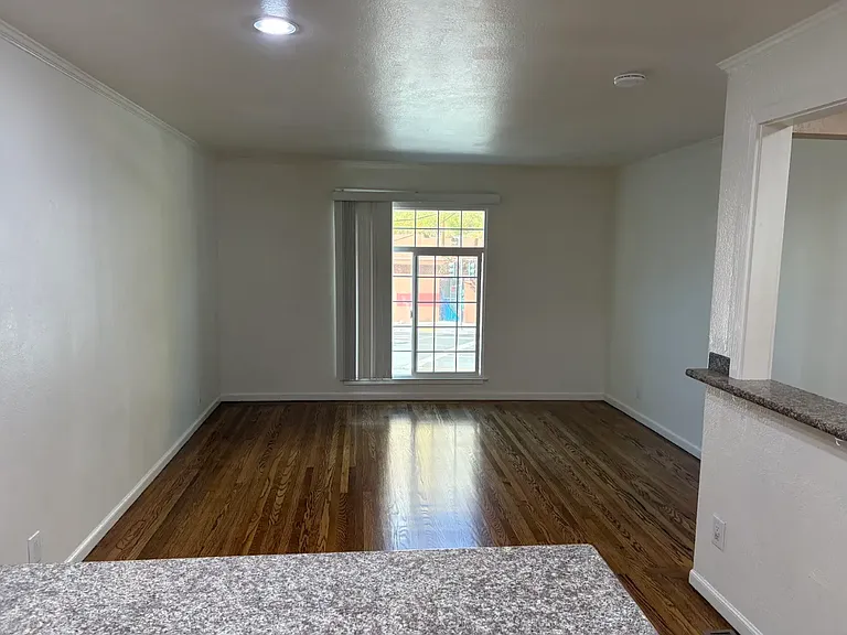 Living area with recessed lighting and finished floors