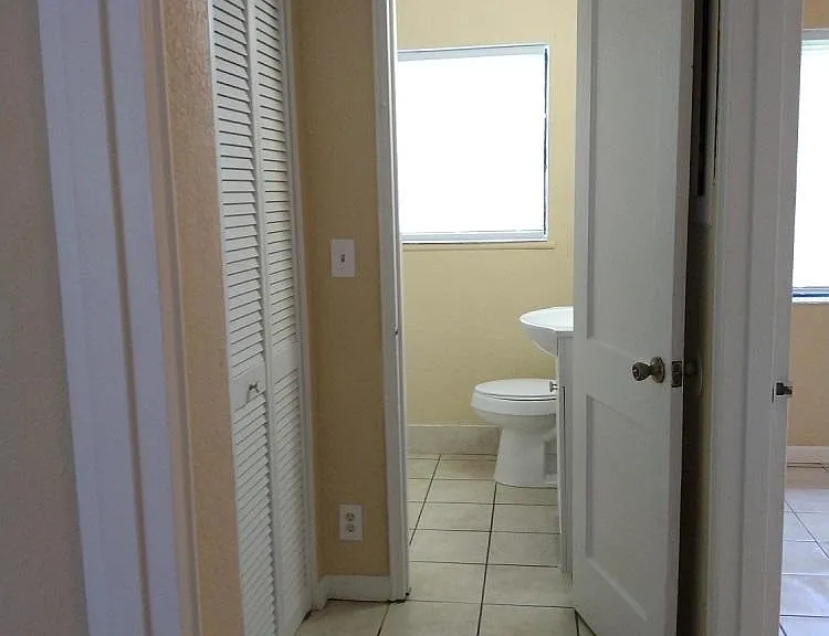 View from Hall into Bathroom.