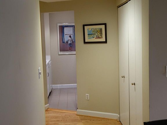 View from DR into kitchen. W/D in closet on right