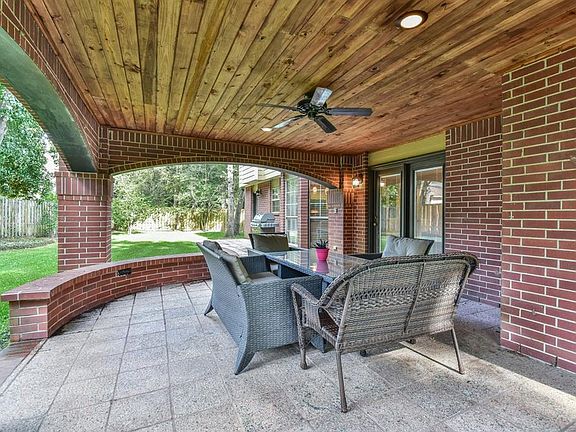 A view of the open patio - notice the beautiful hard wood ceiling and the great view of the backyard.