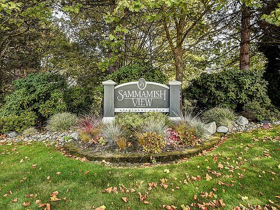 Exterior of Sammamish View sign and landscaped foliage.