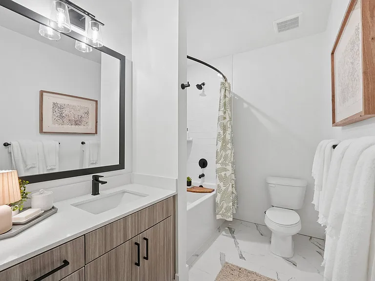 Bathroom with Quartz Countertop and Soaking Tub