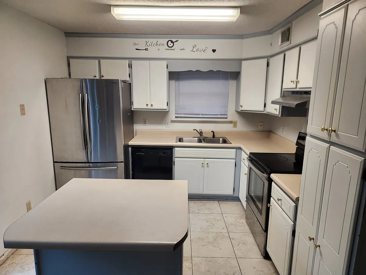 Tile floor, stainless appliances, glass top stove/oven, island with drawers and cabinet space - 3697 Highway 24 #117-B