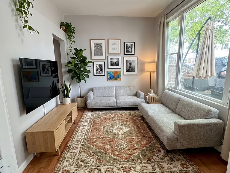 Living- This room has been virtually staged using AI to help visualize its layout and design potential.