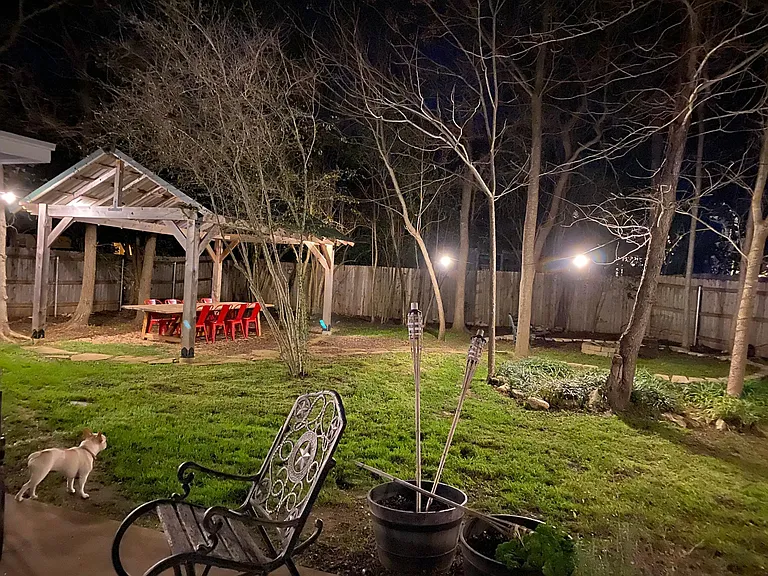 Outdoor pergola and fire pit on right