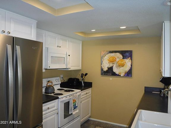 Remodeled kitchen with white cabinets.