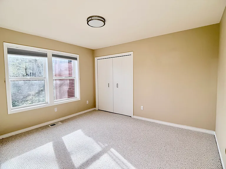 Comfortable, well-proportioned bedroom in private wing offering a versatile layout to suit a variety of needs.
