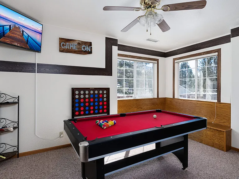 Upstairs game room, pool table, smart TV, and door to outside Hot Tub and 360 walk around HUGE deck.