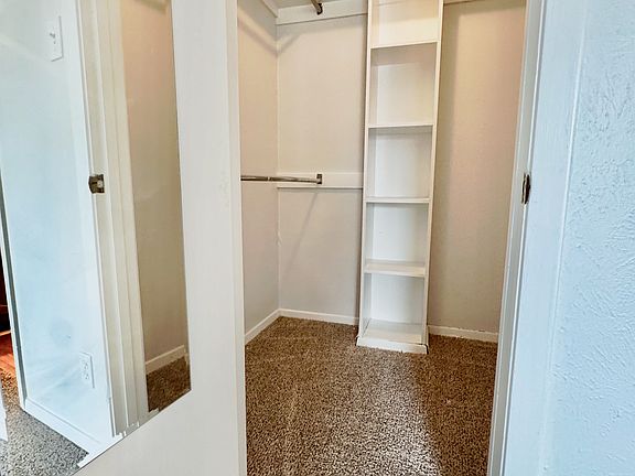 walk in closet in primary bedroom