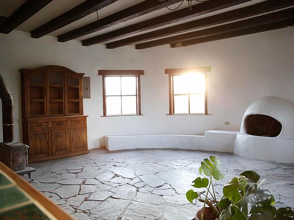 Living room, note fireplace and wood burning stove.