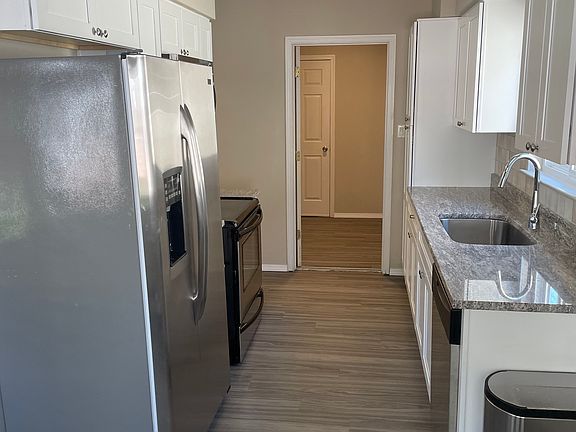 Kitchen that leads into the laundry room and then the attached two-car garage