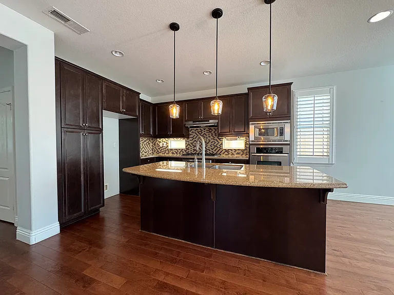 Kitchen - Refrigerator included. Two ovens