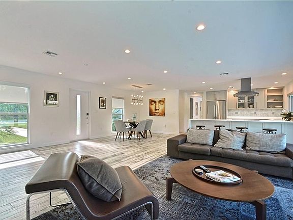Living Room with Kitchen and Dining Space in Background