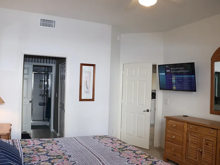 Main bedroom located off living room, sliders to porch