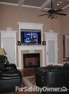 Living Room : Custom crown molding and pediments thoughout the house