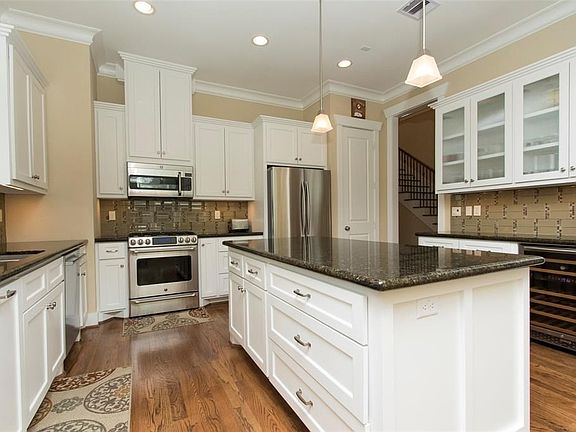 Large kitchen with entertaining island, dual temp wine chiller at butler station, tons of storage space