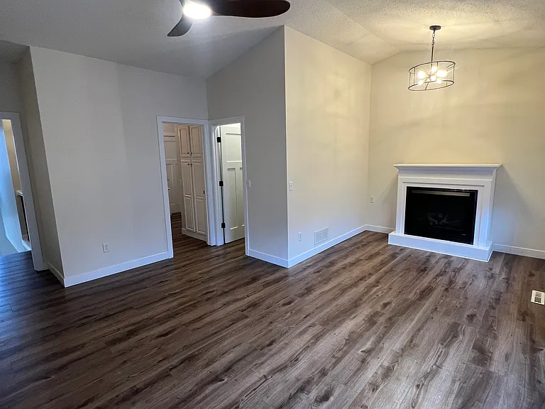 Primary bedroom with fireplace and walk-in closet