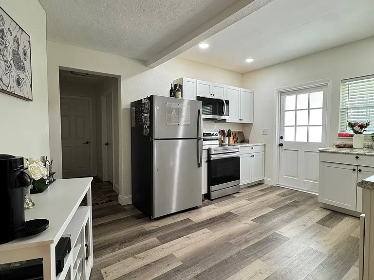 Kitchen with stainless steel appliances, including dishwasher