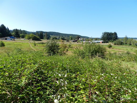 From hillside looking out over pasture Northwest>