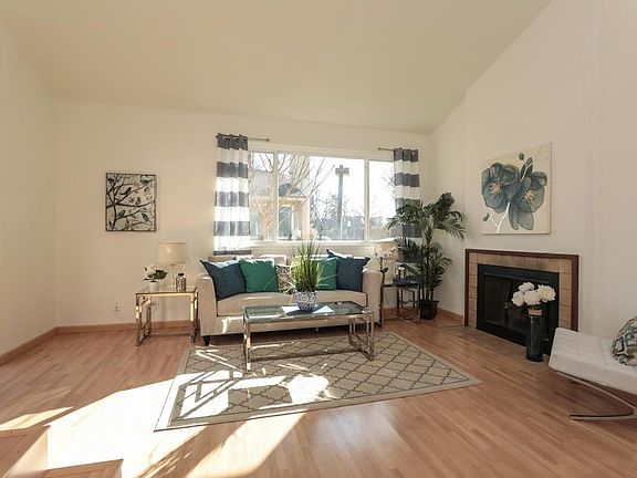 Living room with a view to the outside. Sliding room to the left leads to the Front Patio.