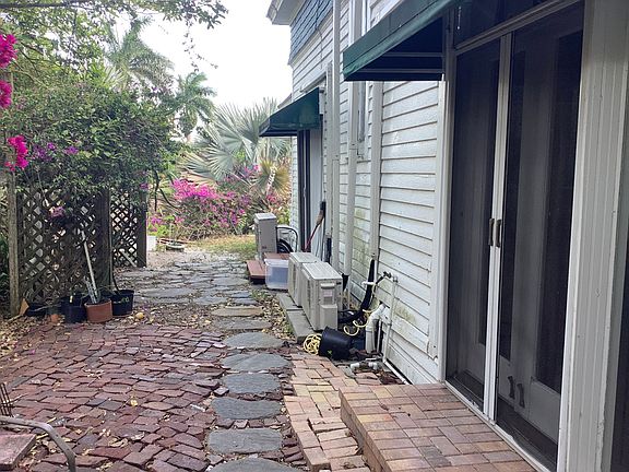Side of main house. Both residences have mini-split heat and air conditioning.