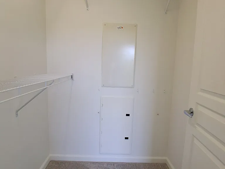 Large Bedroom Walk-in Closet with Built-in Shelving