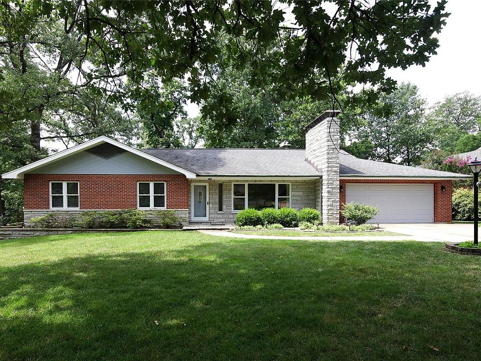 Welcome to this mid-century modern home at 7368 Whitehaven Drive, Grantwood Village in popular Forest Haven Subdivision and TOP Lindbergh School district.