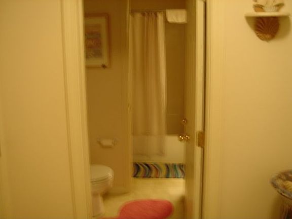 Hallway looking into 1/2 bath.