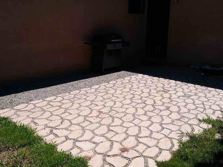 Small patio area in backyard.