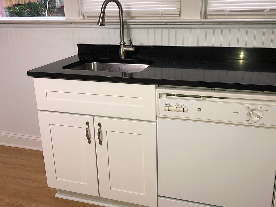 Kitchen with black quartz countertop