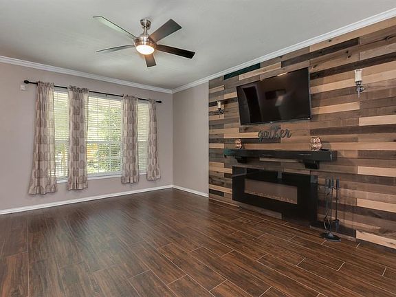 Recently added accent wall in living room draws the eye to the fireplace.