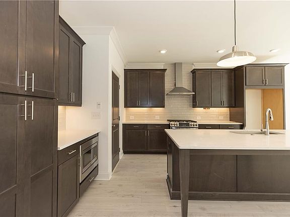 Tons of cabinets for storage Photos of a previously built home and Not of Actual Home Home is un