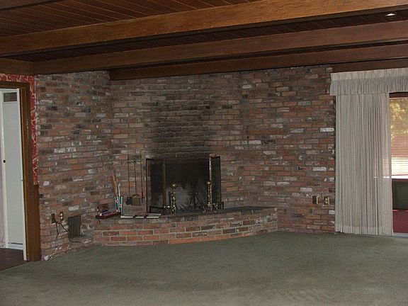 Large used brick living room fireplace