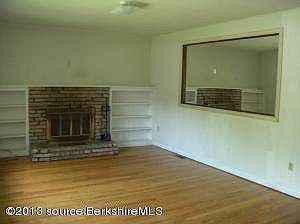 living w hardwood and fireplace