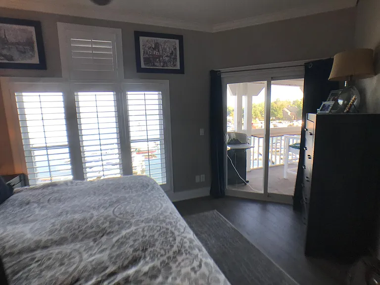Master Bedroom with sliding doors to lakeside deck