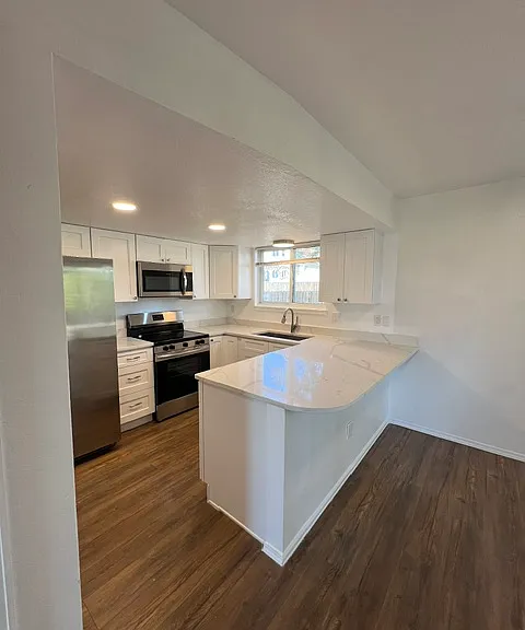 KITCHEN ISLAND FOR SEATING AND PATIO DOOR ACCESS TO BACK YARD.