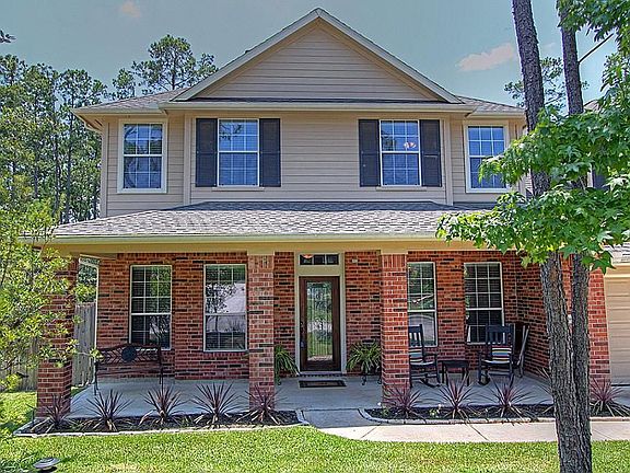 A long covered front porch and perfectly manicured planting bed welcomes you.