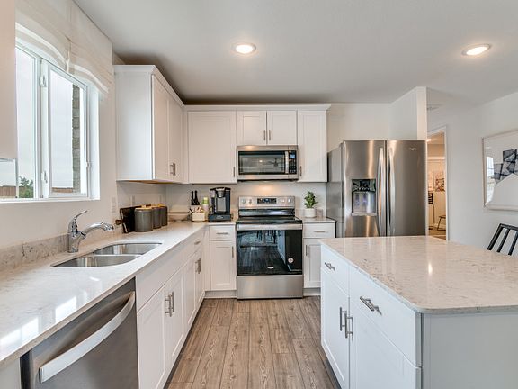 Abundant cabinet space in kitchen model representation