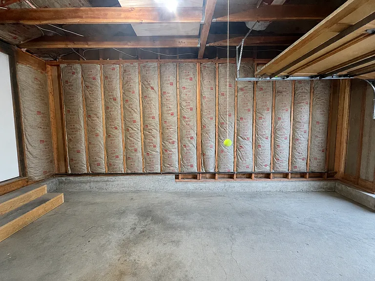 2-car insulated garage with bonus fridge/freezer and work bench