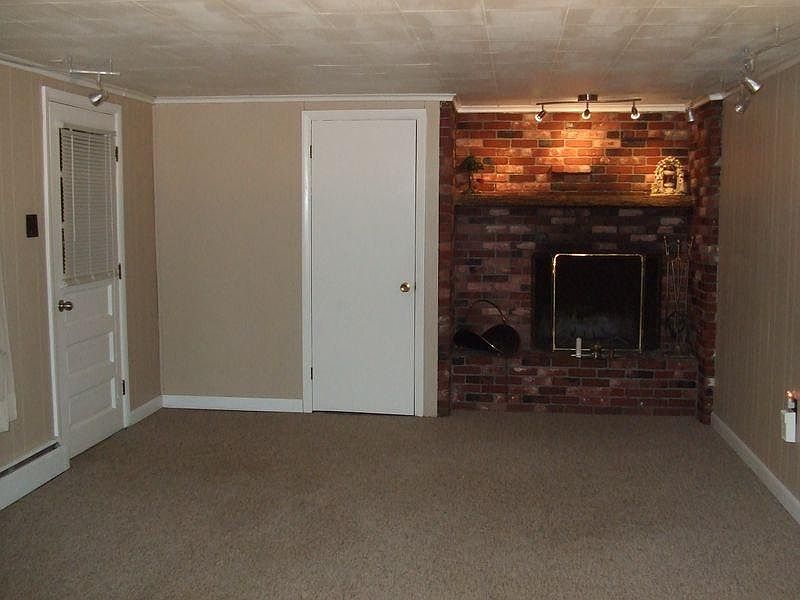 Entry into living room w/fireplace
