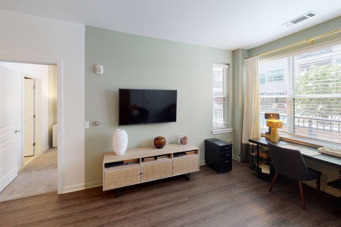 Natural light pours in through the living area''s open windows