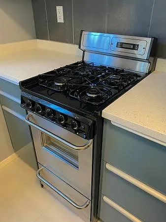 Gas Range, Ample Storage surrounding, quartz counter